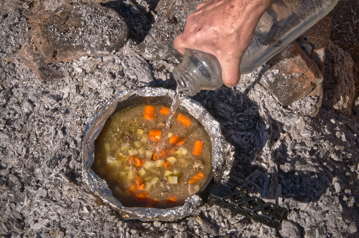 Image: cooking dinner at the campfire