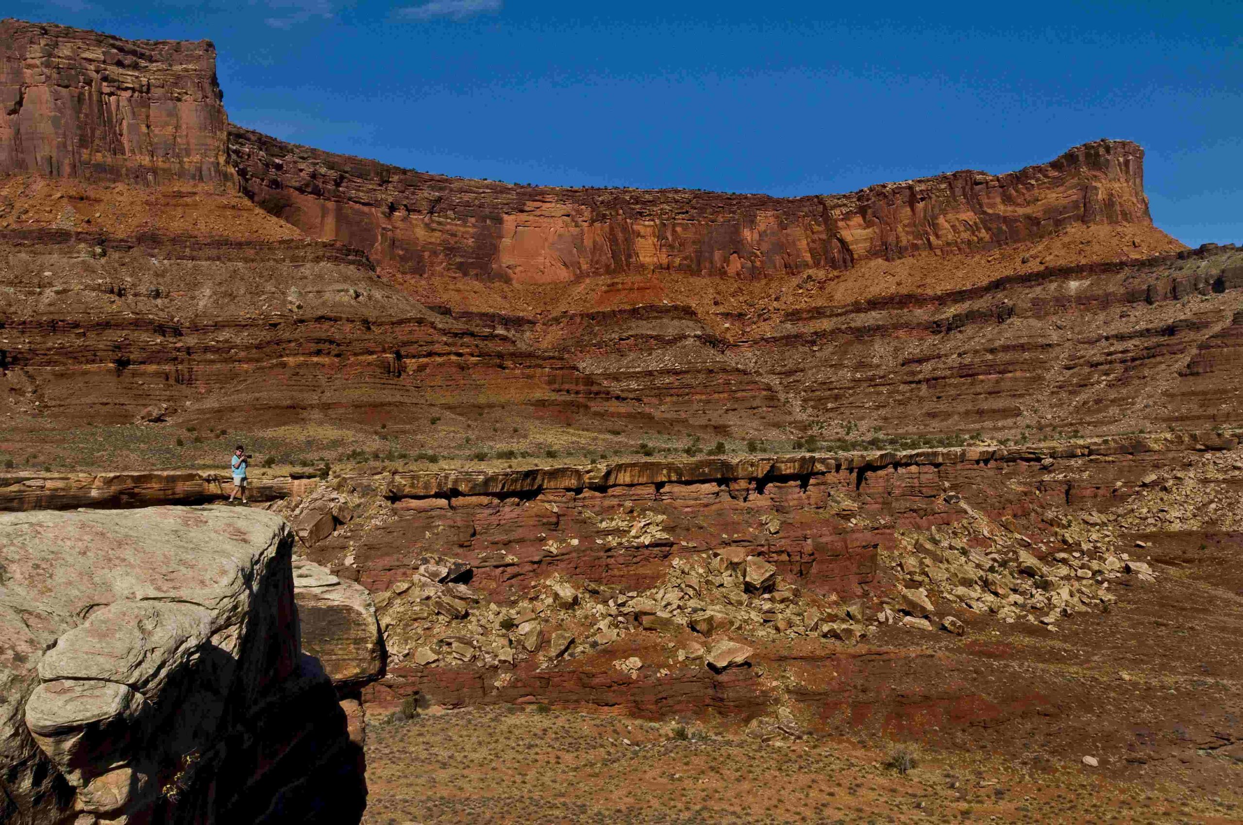 Photographing Jurassic layers from a giant hoodoo top.